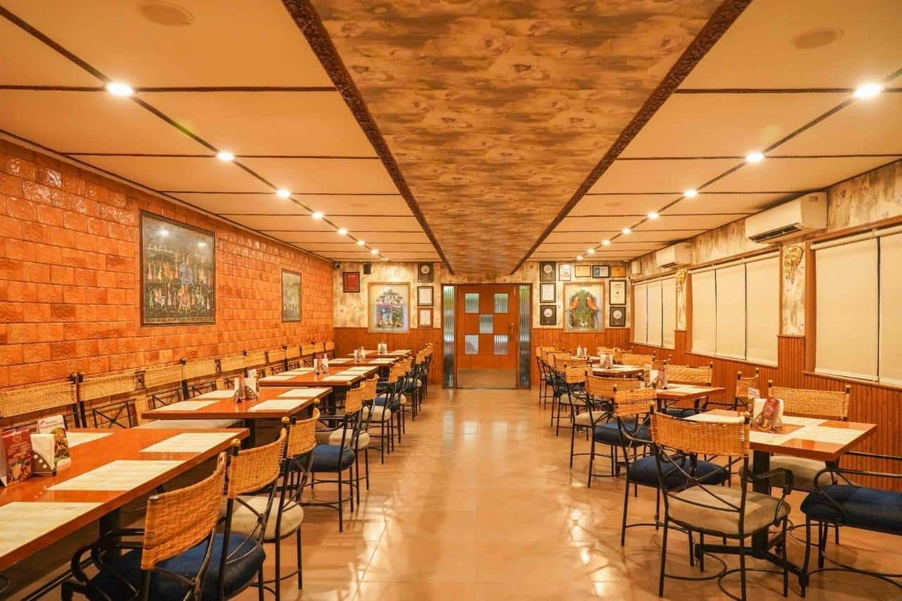 Dining hall with set tables at The Spicy Venue
